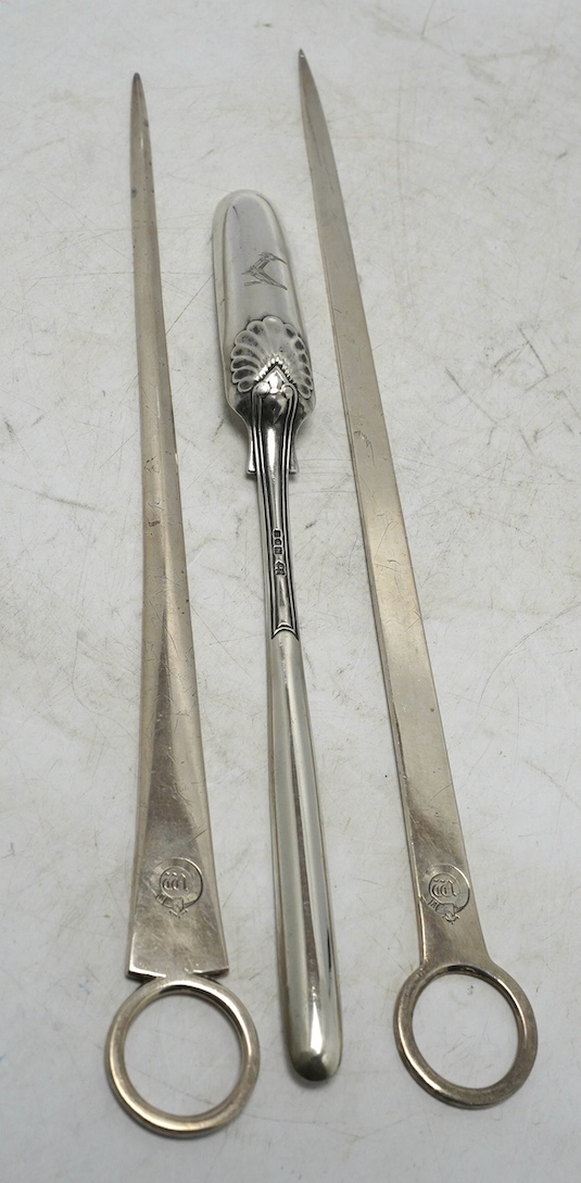 Two George III silver meat skewers by John Lias, London, 1800 and 1801, 29.9cm, together with an Edwardian silver marrow scoop. Condition - fair